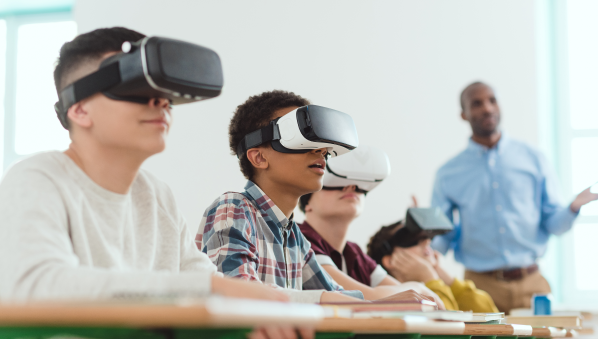 Students wearing VR headsets, engaging in a virtual science experiment or historical site exploration.